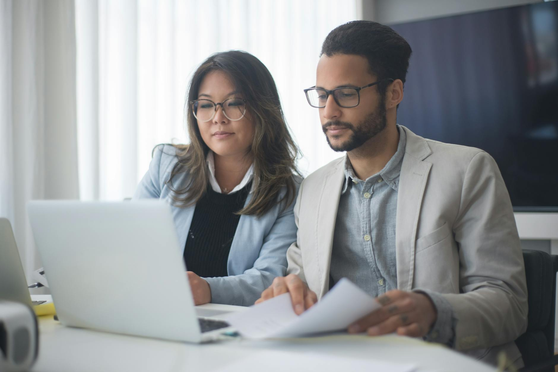 a man and a woman collaborating in business